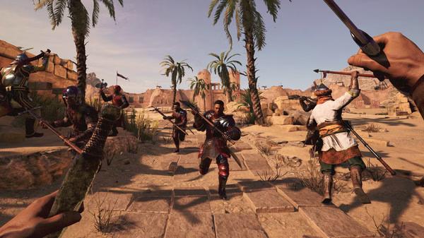 Chivalry 2 screenshot: Players engage in a chaotic medieval battle in a desert village surrounded by palm trees and stone structures.