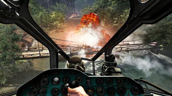 Call of Duty: Black Ops screenshot showing a helicopter cockpit view as an explosion erupts near a wooden bridge in a forested area.