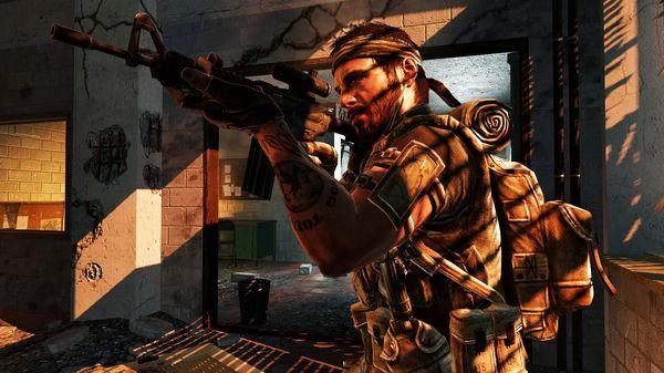 Screenshot from Call of Duty: Black Ops showing a soldier aiming a rifle inside a damaged building with sunlight streaming in.