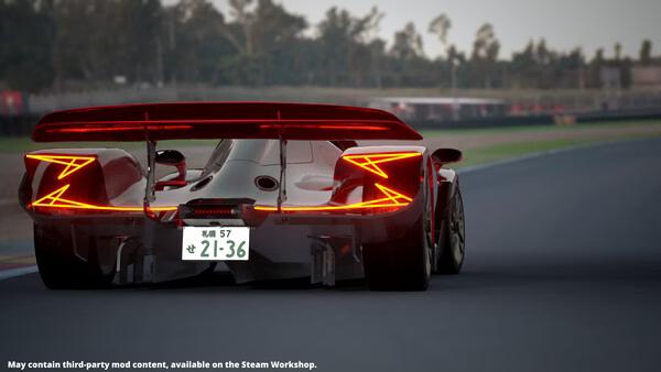 Screenshot from Automation - The Car Company Tycoon Game showing a sleek race car speeding down a track with trees in the background.