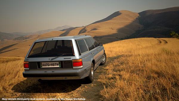 Screenshot from 'Automation - The Car Company Tycoon Game' showing a vintage silver station wagon on a grassy hillside.