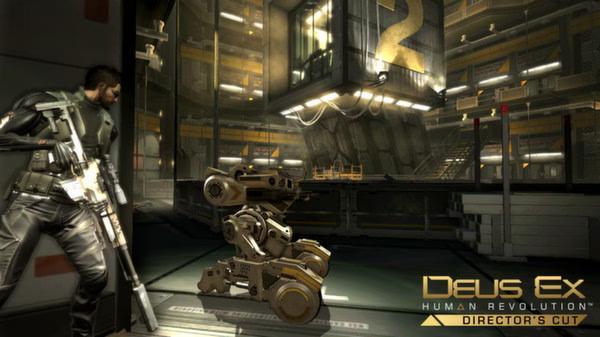 Deus Ex: Human Revolution Director's Cut screenshot: Character in armor holds a rifle, crouching near a robotic drone in an industrial setting.
