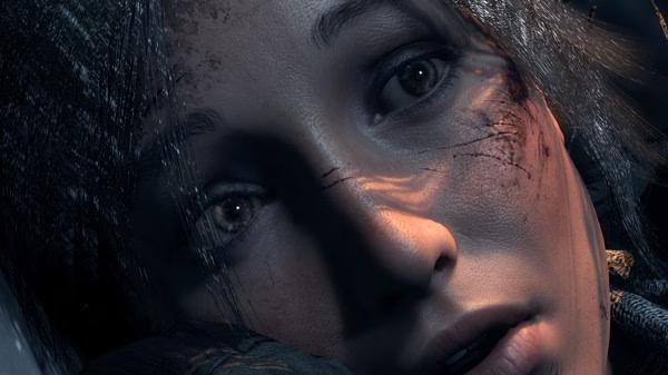 Screenshot from Rise of the Tomb Raider showing a close-up of Lara Croft's face, highlighting her determined expression and battle-worn features.