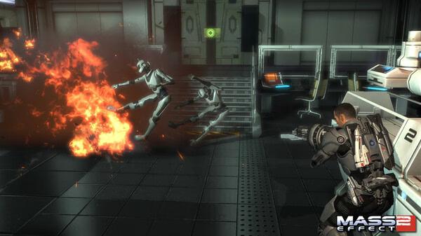 Mass Effect 2 screenshot: A player character fires at two robotic enemies engulfed in flames inside a futuristic lab setting.