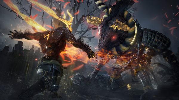 Nioh 2: Complete Edition screenshot showing a fiery clash between a warrior and a horned demon in a dark, eerie battlefield.