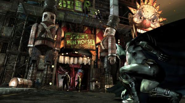 Batman: Arkham City screenshot showing Batman crouched near Joker's Fun House entrance, with two thugs visible in the background.