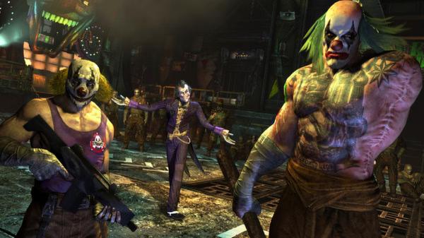 Screenshot of Batman: Arkham City showing Joker flanked by armed thugs in a dark, chaotic industrial setting.