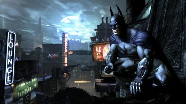 Batman: Arkham City screenshot featuring Batman crouched on a rooftop, overlooking a neon-lit cityscape under a glowing moon.