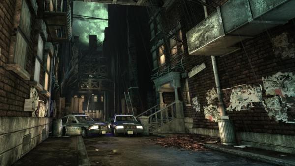 A dark, eerie alleyway from Batman: Arkham Asylum, featuring parked police cars. Game screenshot shows detailed brick textures.