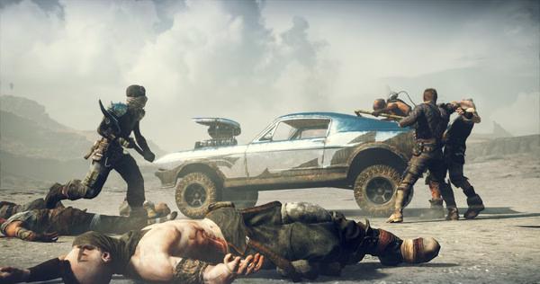 Screenshot from Mad Max game: Characters engage in combat near a rugged, blue vehicle amidst a desert landscape.