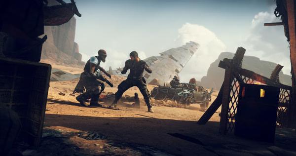 A Mad Max screenshot showing two characters fighting in a desert wasteland, with a crashed plane in the background.