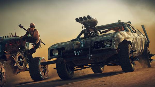 Mad Max screenshot featuring two armored vehicles speeding through a desert landscape, with characters visible in each.