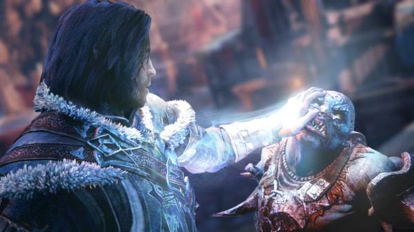 Screenshot from Middle-earth: Shadow of Mordor showing a character gripping an orc's face, with magical effects visible.