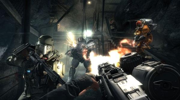 Wolfenstein: The Old Blood screenshot of intense gunfight in a dark tunnel, with soldiers in combat gear exchanging fire.
