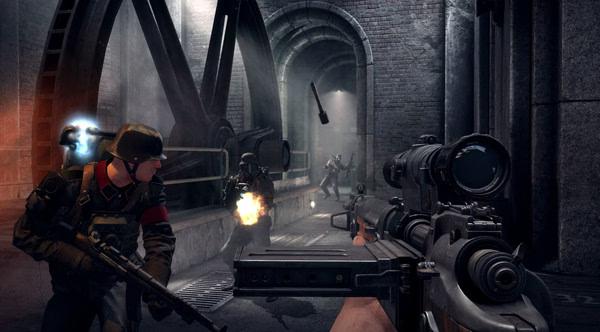 Screenshot from Wolfenstein: The Old Blood showing a player aiming a rifle at enemies in an industrial tunnel setting.