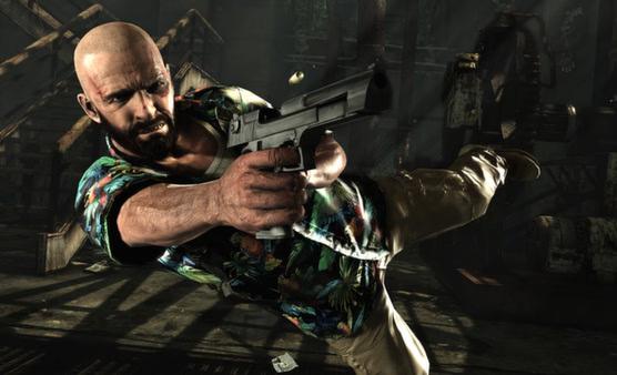 Max Payne 3 screenshot: A man in a floral shirt dives while firing a handgun in an industrial setting with stairs and machinery.