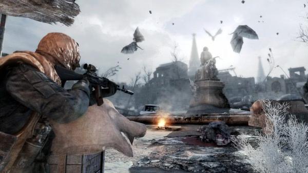 A soldier aims a rifle in a snowy, post-apocalyptic landscape with flying creatures in Metro 2033 Redux. Game screenshot.
