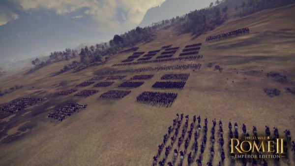 Total War: Rome II - Emperor Edition screenshot: An army formation spans a grassy battlefield under a cloudy sky.