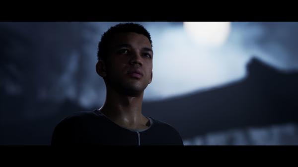 Screenshot from The Quarry game showing a character standing in the moonlit night, gazing upward with an intense expression.