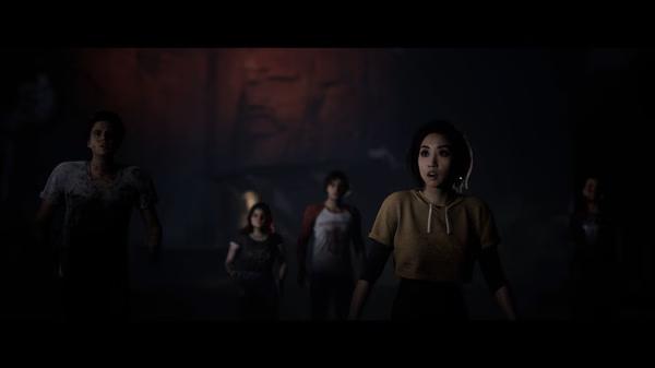 A screenshot from The Quarry showing a group of characters standing together in a dimly lit outdoor setting.