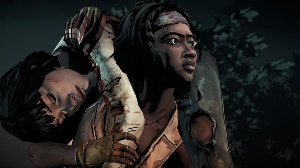 Screenshot from The Walking Dead: The Telltale Definitive Series showing a character carrying a wounded person through a dark forest.