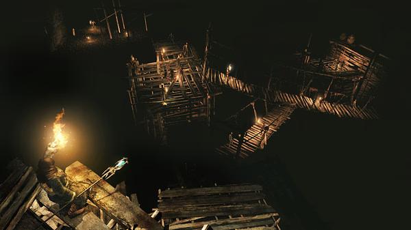 Screenshot from Dark Souls II: Scholar of the First Sin showing a player character with a torch navigating a dark, wooden bridge area.
