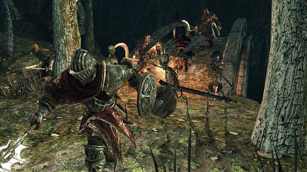 Dark Souls II: Scholar of the First Sin screenshot showing a knight battling skeletons on a bridge in a dark forest setting.