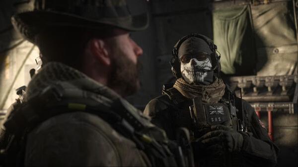 Call of Duty: Modern Warfare III screenshot showing two soldiers in tactical gear, one with a skull face mask, inside a military aircraft.