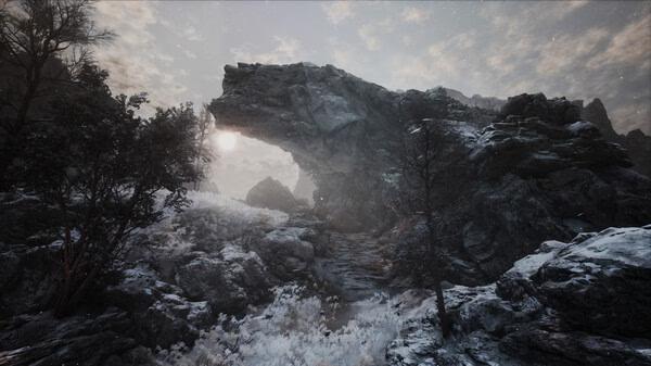 Screenshot from The First Berserker: Khazan showing a rugged, snow-covered landscape with rocky formations under a cloudy sky.