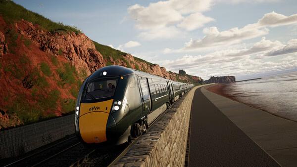 Screenshot of Train Sim World 6 showing a modern GWR train traveling along a scenic coastal route with cliffs and water nearby.