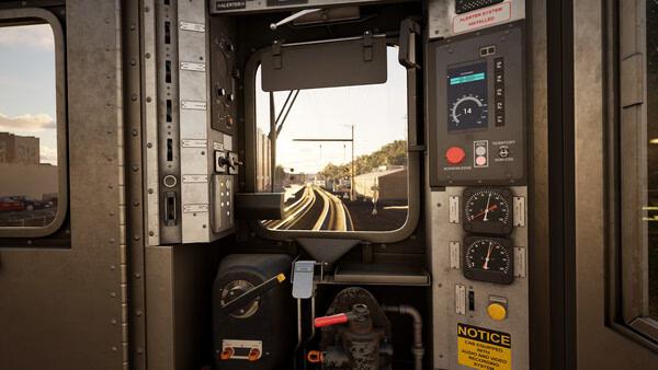 Train Sim World 6 screenshot showing the interior controls of a train cab, with tracks and scenery visible through the front window.