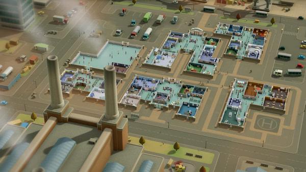 Two Point Hospital screenshot showing a sprawling medical complex with various departments and busy staff attending to patients.