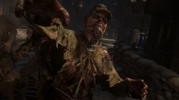 Call of Duty: WWII screenshot showing a zombie soldier lunging forward in a dark, war-torn street setting.