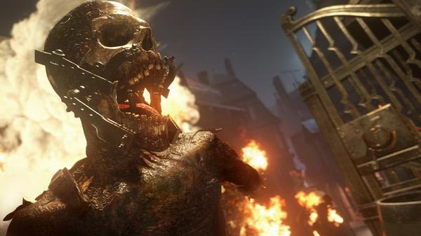 Screenshot from Call of Duty: WWII featuring a fiery, skeletal creature in a dramatic battle scene with flames and a gate.