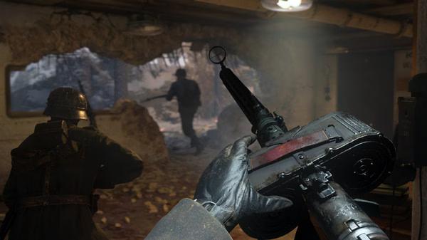 Screenshot from Call of Duty: WWII showing a soldier aiming a machine gun at enemies through a hole in a wall.