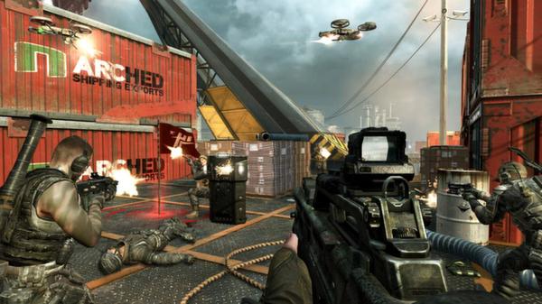Call of Duty: Black Ops II screenshot showing a chaotic firefight with soldiers, drones, and shipping containers in an industrial area.