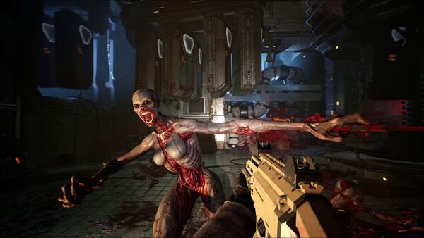 A Killing Floor 3 screenshot showing a player aiming at a grotesque mutant attacking in a dark, industrial environment.