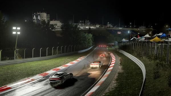 A Forza Motorsport screenshot showing cars racing on a wet track at night, with bright lights and tents in the background.