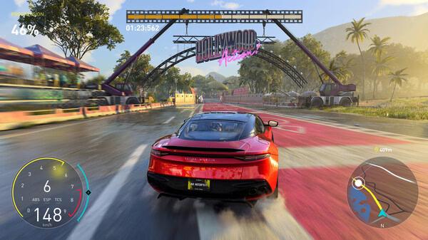 Screenshot from The Crew Motorfest showing a red sports car racing through a sunny track near the "Hollywood" sign.