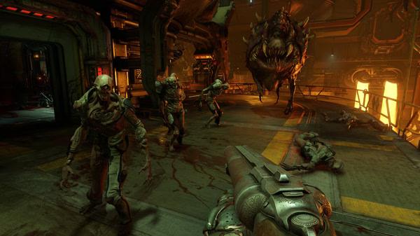 DOOM screenshot: A player faces off against a group of undead creatures and a large monster in a dimly lit industrial setting.
