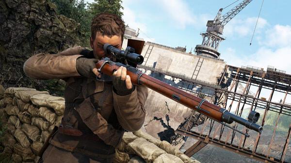 Sniper Elite: Resistance screenshot showing a soldier aiming a sniper rifle near a damaged industrial site with a crane in the background.