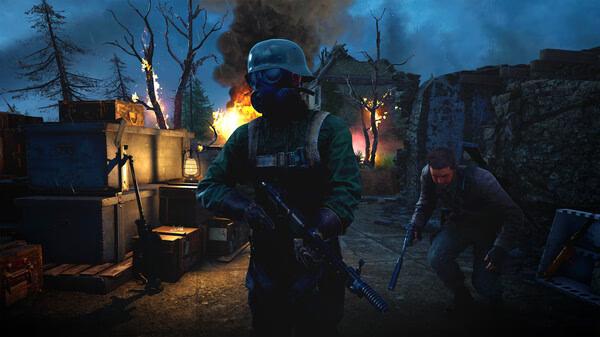 Sniper Elite: Resistance screenshot: A soldier in a gas mask stands armed, while another crouches behind crates amidst fiery chaos.