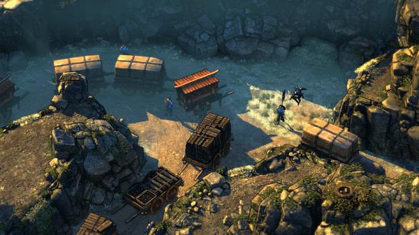 Screenshot from Shadow Tactics: Blades of the Shogun showing characters navigating a rocky terrain with carts and a bridge.