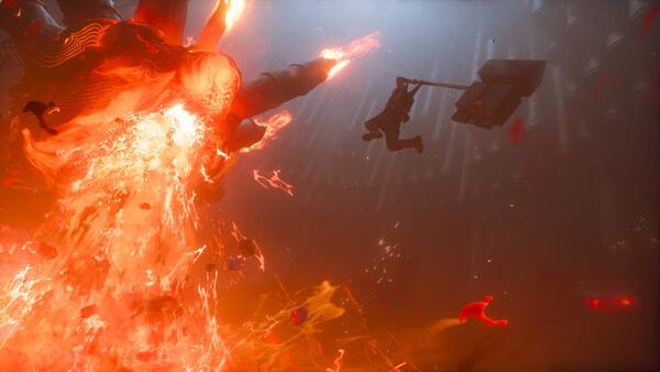 Screenshot from CONTROL Resonant showing a fiery explosion as a character leaps with a sledgehammer in a dramatic action scene.
