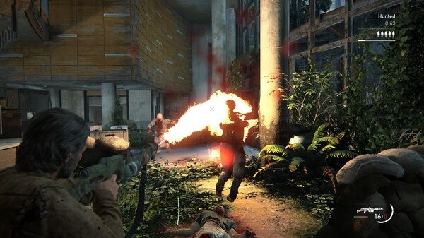 A screenshot from The Last of Us Part II Remastered shows a character using a flamethrower in an overgrown building.
