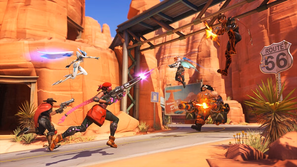 Overwatch® screenshot: Action-packed battle on Route 66 with heroes McCree, Sojourn, Genji, and others exchanging fire.