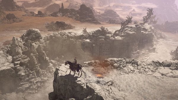 Screenshot of Diablo® IV showing a character on horseback overlooking a rocky, desert landscape with distant mountains.