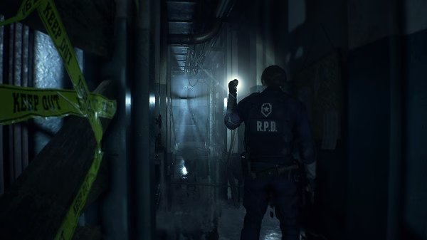 Resident Evil 2 screenshot: A police officer in an RPD uniform explores a dark, eerie hallway with caution tape and a flashlight.