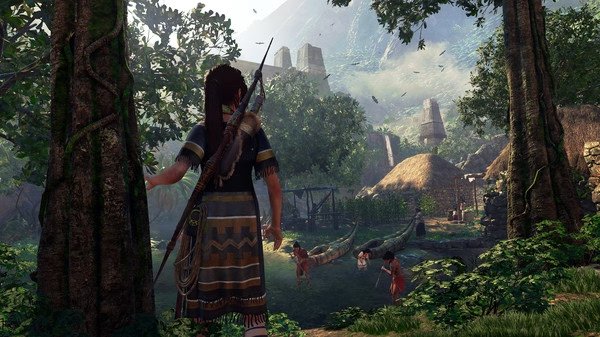 Screenshot from Shadow of the Tomb Raider showing a character standing in a lush jungle village with people and huts in the background.