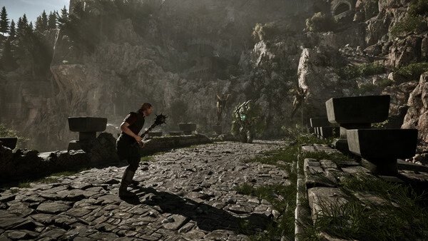 A Gothic 1 Remake screenshot showing a warrior with a mace facing a large green creature on a stone bridge in a mountainous area.